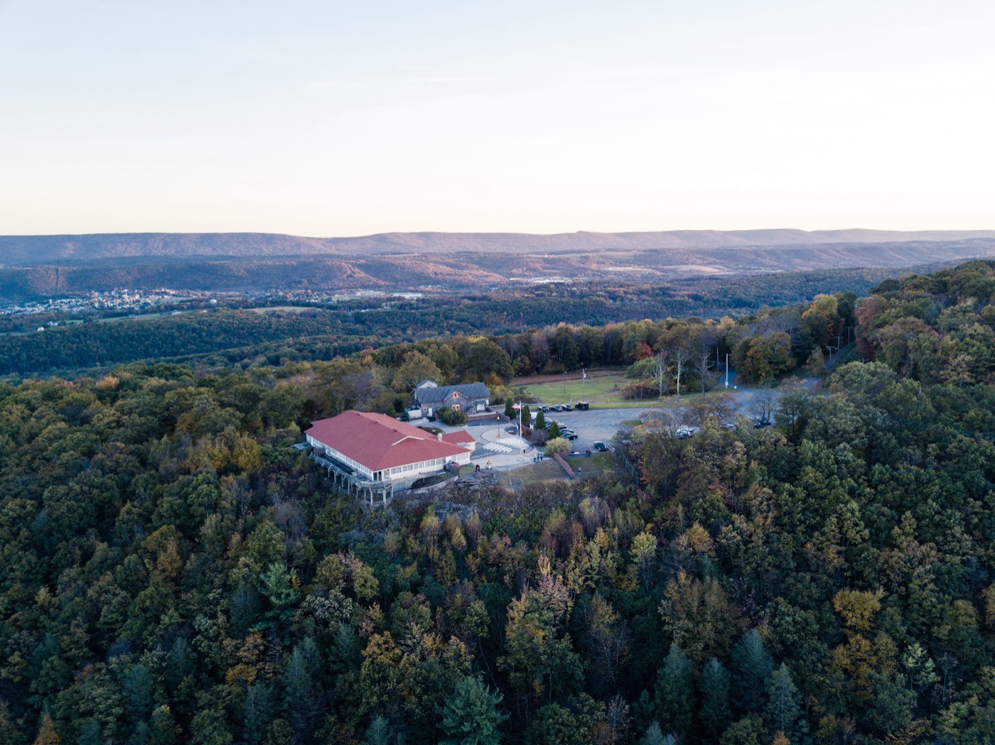 Aerial view of a mountaintop event venue overlooking a valley